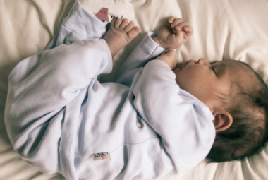 Baby Keeps Rolling Over in Sleep and Waking Up