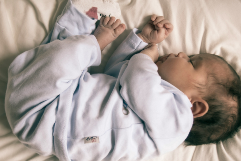 Baby Keeps Rolling Over in Sleep and Waking Up